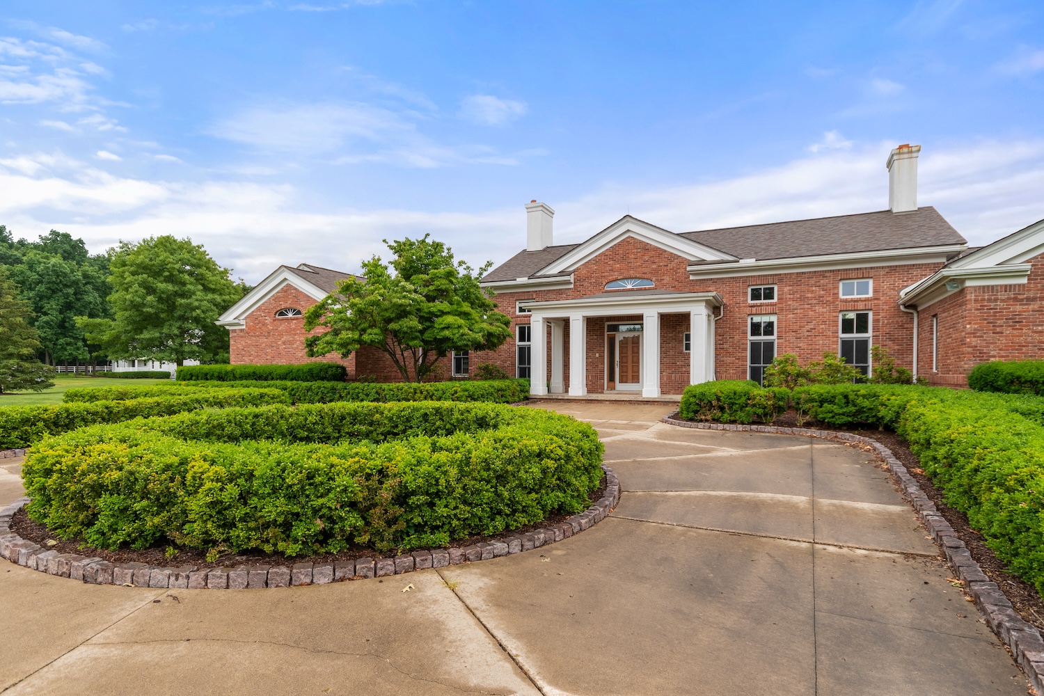 Brick main house and circle drive at 14091 Scio Church Rd