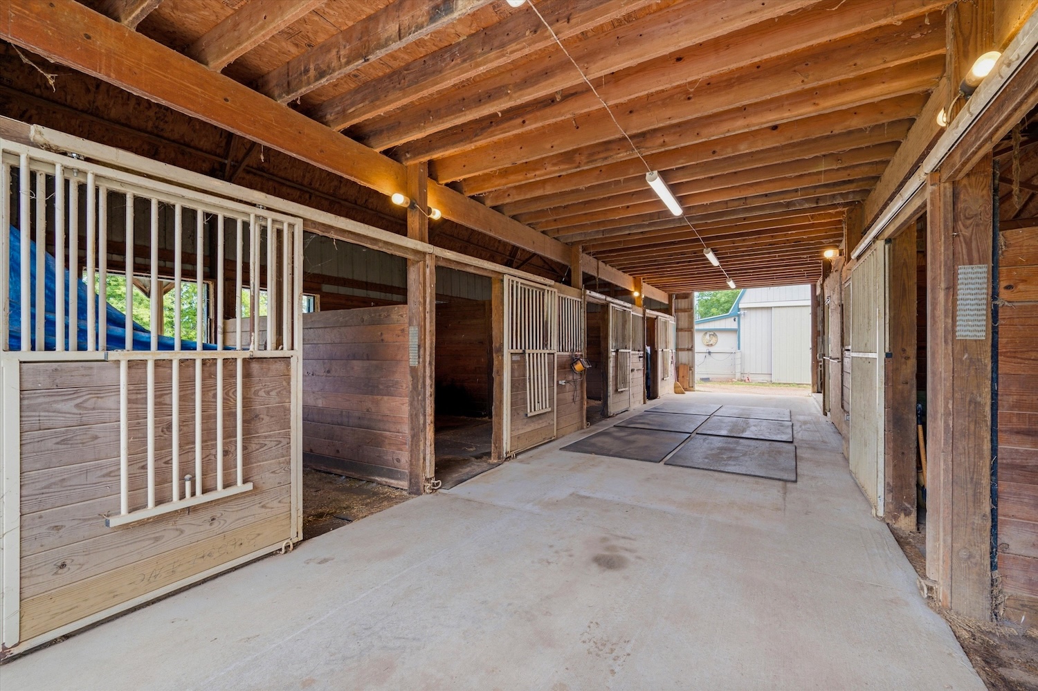 Barn aisle and stalls at 7310 Steinbach Road