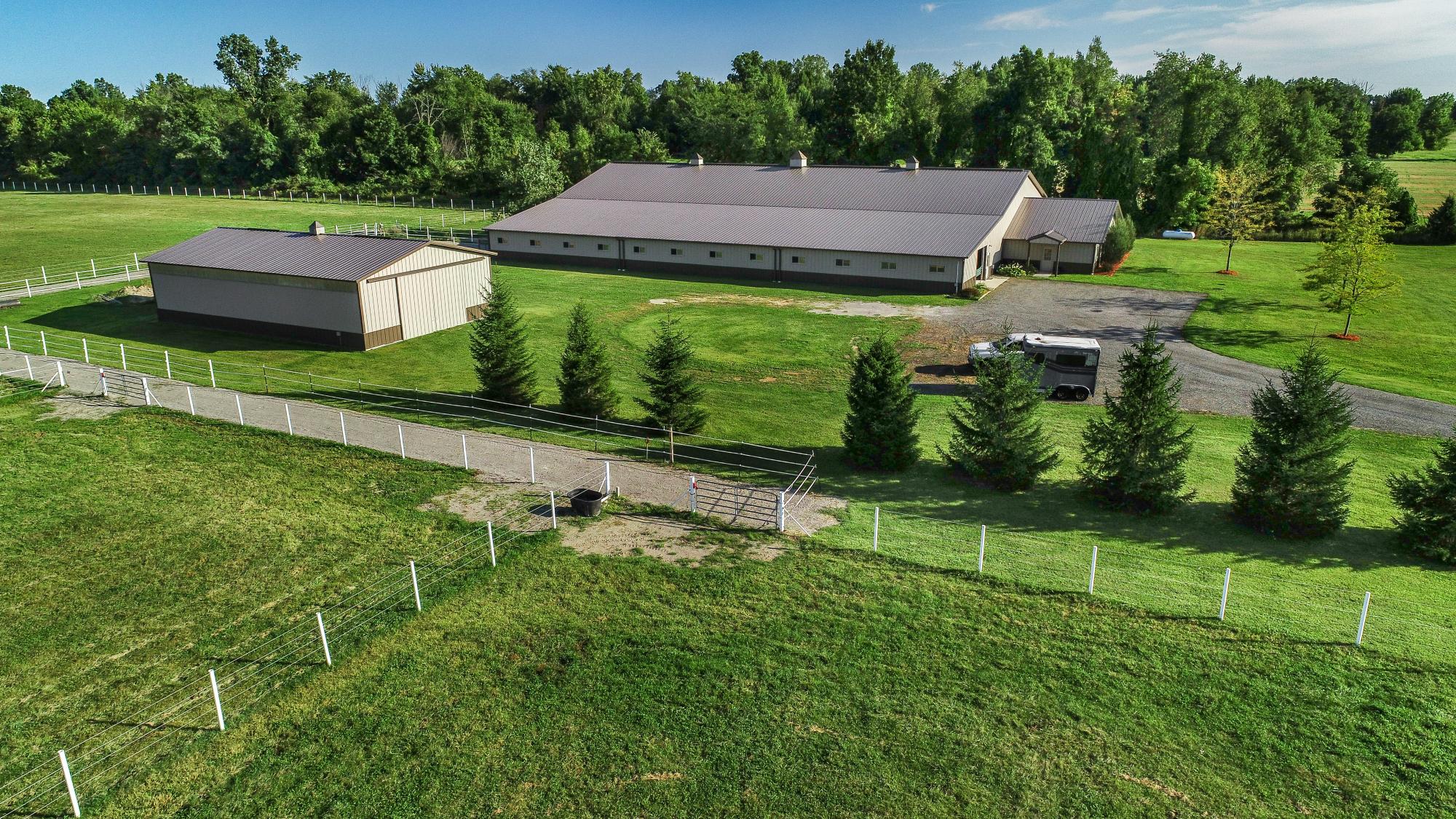 Aerial view of horse barns and fenced pastures in Genesee County