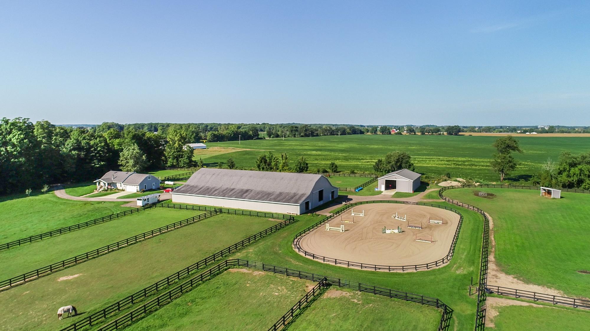 Horse farm with outdoor riding arena and paddocks in Ingham County