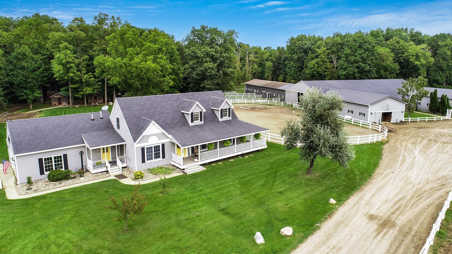 Farmhouse with horse barn and riding arena in Lenawee County